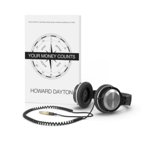 Your Money Counts Book and headphones resting next to it.