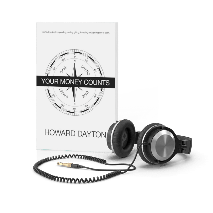 Your Money Counts Book and headphones resting next to it.