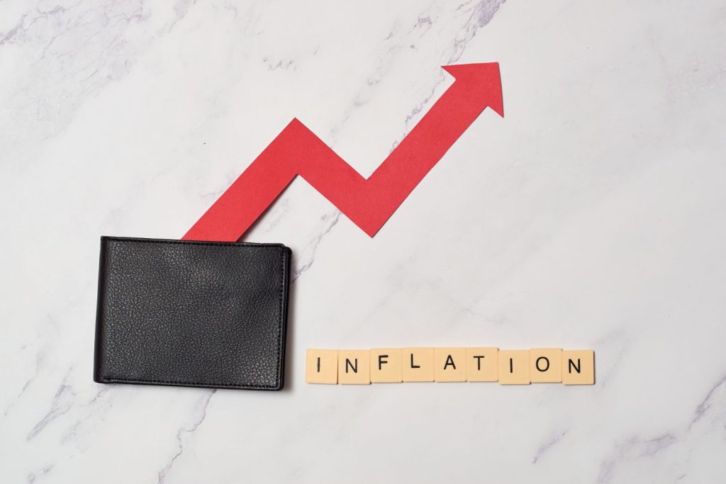 Inflation graphic - red arrow growing out of wallet with the word Inflation in scrabble letters.